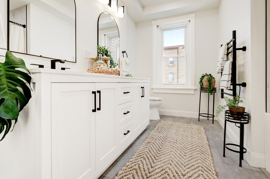 Lancaster Primary Bathroom Remodel with white double vanity
